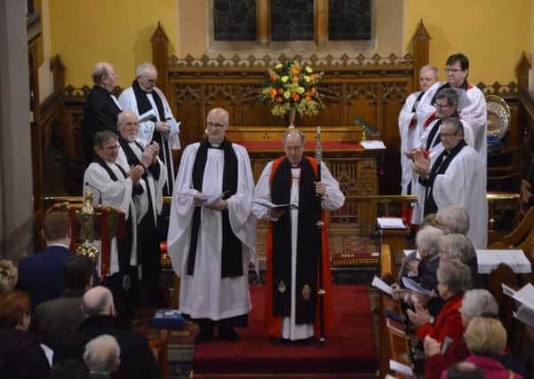 Parishioners and fellow clergy acclaim the Rev Robert Boyd following his Institution as Rector of Glendermott with Newbuildings