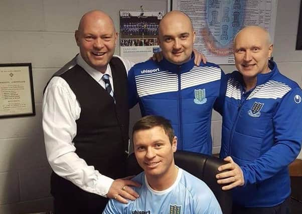 Kevin Braniff is welcomed to the club by manager David Jeffrey (left) and his backroom staff. Pic: ballymenaunitedfc.com