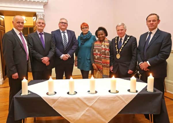 Pictured at the Holocaust Memorial Day event in the Irish Linen Centre and Lisburn Museum are (l-r) Jim Rose, Director of Leisure & Community Development; Councillor Tim Morrow, Chairman of the council's Leisure & Community Development Committee; Professor Peter Shirlow, University of Liverpool; Stephanie Mitchell, Belfast Friendship Group; Sipho Sibanda; Mayor Brian Bloomfield MBE and Mr Freddie Hall OBE QGM, Deputy Lord Lieutenant of County Antrim.