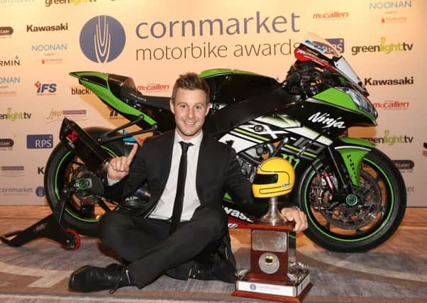 Cornmarket Irish Motorcyclist of the Year, Jonathan Rea, with the Enkalon Joey Dunlop trophy.