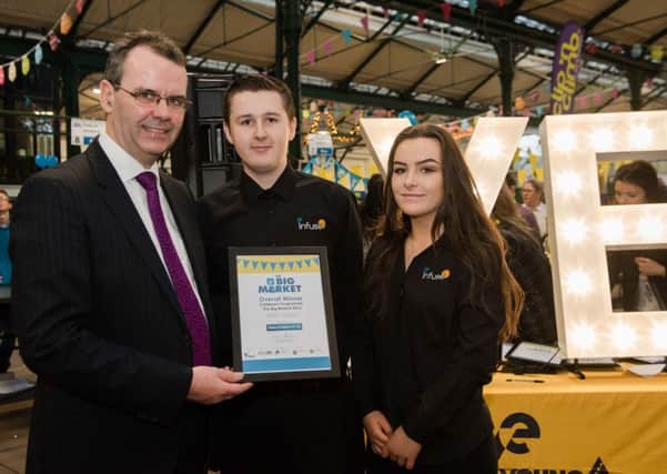 Children from  Newbridge Integrated College who were joint winners in the Young Enterprise Big Market contest and who will be at the trade fair event at Rushmere Shopping Centre . Looking on is Mark O'Brien from award sponsor Bank of Ireland.