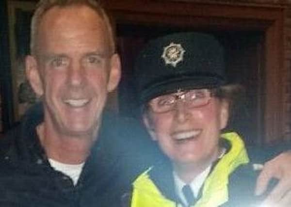 Superstar DJ Fatboy Slim poses with a Coleraine police officer who was on duty during his gig at Kelly's nightclub. INLT-05-700-con