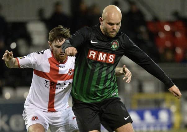 PSNI striker Lukas Adamczyk up against Howard Beverland during the last meeting with Crusaders. Pic by PressEye Ltd.