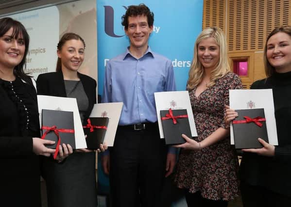Natalie Watson from Lisburn (far right) is pictured receiving her award from Adrian Devine, Ulster University Course Director.  Also in the picture are fellow award winners (from left) Laura Christie, Louise McCrea and Aimee Davey.