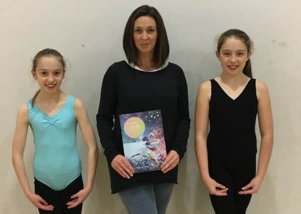 Zarah Freeburn and Evie Macdonald, with their dance teacher Principal Jill Dickson Monte.