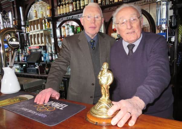 Eamon Molloy and Seamus McCaffrey in the famous McConvilles bar which is an A-listed building.