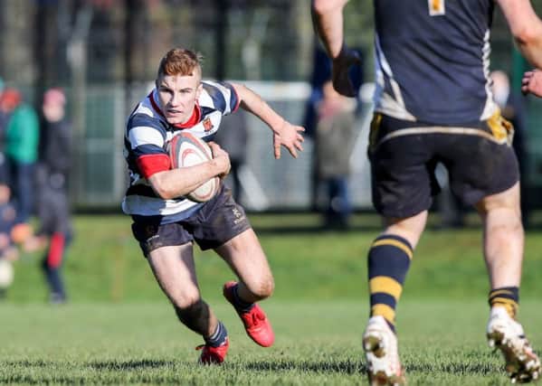 Wallace's Jonny Hunter in action against Omagh Academy