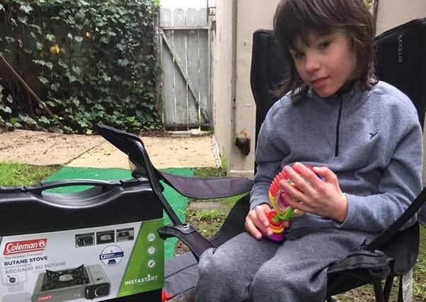 Billy Caldwell with some of the camping equipment his mother bought in preparation for sleeping rough