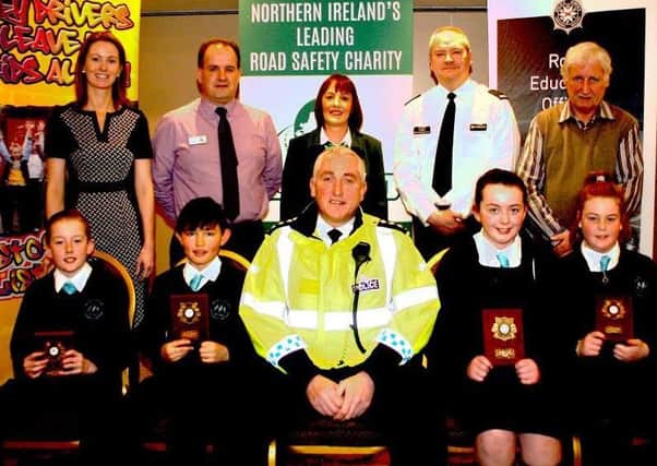 Children from Roe Valley Primary School who were runners-up in the local heat of the Northern Ireland Road Safety Quiz held at the Lodge Hotel, Coleraine. Included is (front centre) Chief Inspector Ian Magee who presented the prizes, (back row from left) Joanne O'Donnell, teacher, Peter Melarkey, Joan Kinnaird, Road Safety Council, Sydney Henry, Roads Policing and Sam Knox, Road Safety Council.