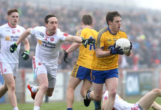 Colm Cavanagh gets to grips with 
Conor Devaney of Roscommon during the league opener in Healy Park on Sunday. (
Picture by Andrew Paton/Press Eye)