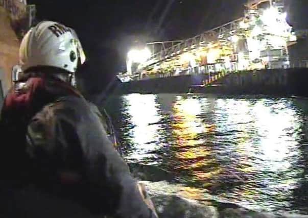 Larne RNLI carry out a medical evacuation from a carrier vessel. INLT-05-712-con
