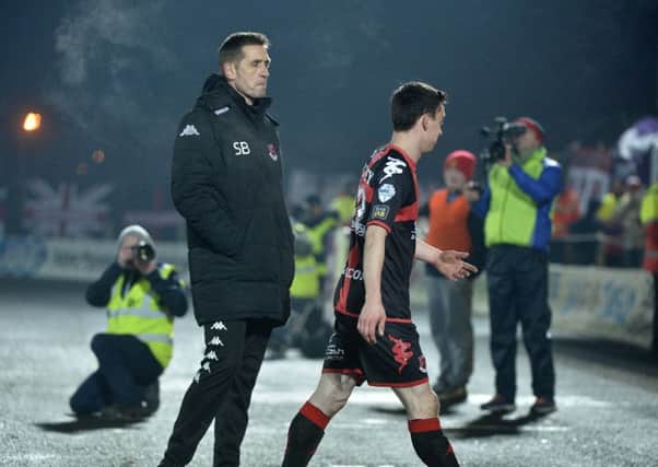 Crusaders manager Stephen Baxter looks on as Paul Heatley leaves the pitch following his red card. Pic by PressEye Ltd.