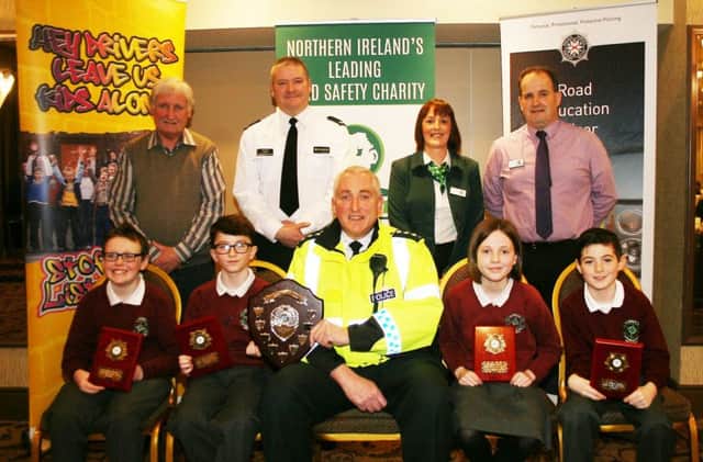 Chief Inspector Ian Magee presents the Shield to the winners of the local heat of the Northern Ireland road safety quiz organised by Road Safe N.I., St. Brigid's Primary School, Mayogall, near Magherafelt, at the Lodge Hotel, Coleraine. Included are back row from left Sam Knox, Road Safety Council, Sydney Henry, Roads Policing, Joan Kinnaird, chair N.I. Road Safety council and Peter Melarkey, Road Safety Council.