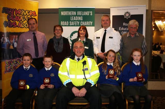 Rasharkin Primary School who gained third place in the regional heat of the Northern Ireland Road Safety Quiz for primary schools organised by Road Safe N.I. at the Lodge Hotel, Coleraine. Included is Chief Inspector Ian Magee, Peter Melarkey, Joan Kinnaird, and Sam Knox, Road Safety Council and Sydney Henry, Roads Policing and Alison Gilmore, Classroom Assistant, Rahsarkin P.S.