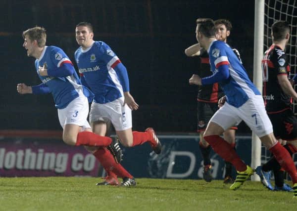 Linfield's Cameron Stewart celebartes after  heading the Blues into a 1-0 lead in Tuesday night's 
Toals County Antrim Shield final at the Showgrounds in Ballymena. (
Photograph by Presseye/Stephen Hamilton