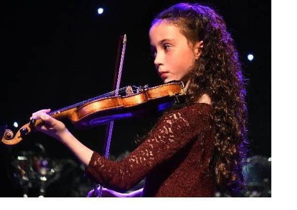 Beth McConnell from Portadown performing her violin solo at the final night of Portadown Music Festival last year. INPT17-208.