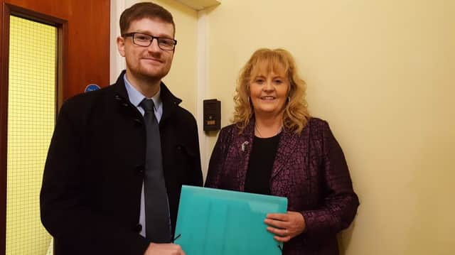 North Antrim candidate Adam McBride submitting his nomination papers with Rae Kirk, Area Electoral Officer. INBM 07-701-CON