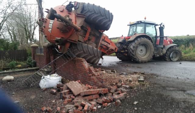 Pacemaker Press Belfast 10-02-2017: A vehicle collided with a tractor on the Belfast Road, Glenavy and then the tractor with a slurry trailer crashed into a wall of a house.
Picture By: Pacemaker Press