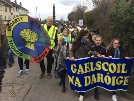 Pupils march in Ballymagroarty this afternoon.