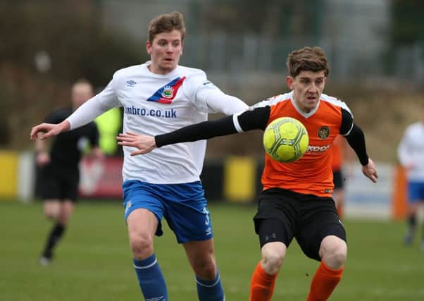 Carrick Rangers Paddy McNally and Linfield's Cameron Stewart