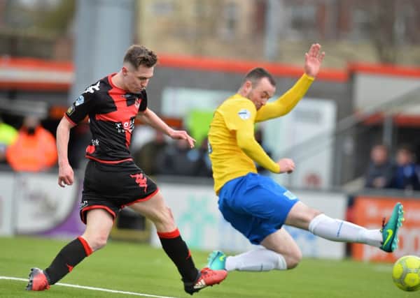Gavin Whyte breaks the deadlock for Crusaders against Ballymena United. Pic by Pacemaker.