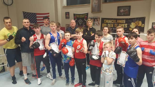 Boxers from Churchlands Golden Gloves pictured with the six County title winners and coaches Mickey Fleming and Roberta Gaile.