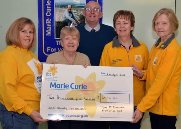 The annual Tom McAleenen Memorial Quiz Night at Goodyear Social Club has raised an amazing Â£2570 for Marie Curie. Pictured at the presentation of the cheque are from left, Yvonne McAleenan, organizer, Lauri McAleenan, Tony Moore, chairman, Goodyear Social Club, Sandra Spence, community fundraiser, Marie Curie, and Margaret Coleman, chairperson of the Craigavon Marie Curie Fundraising Group. INLM18-202.