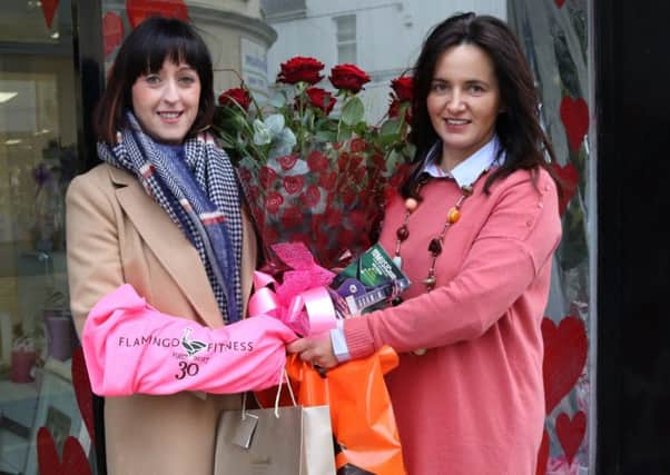 Ballymena BID online competition winner Ciara McCaul receiving her prizes, kindly donated by local businesses, from Alison Moore, Ballymena BID manager.