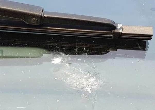 A vehicle damaged by youths hurling stones or rubble in the Harbour Highway area. INLT-08-705-con