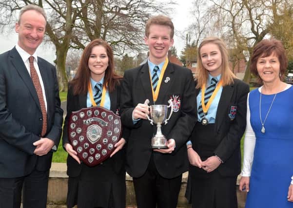 The Portadown College No. 1 debating team have won both the local and Northern Ireland heats of the Business and Professional Women's annual debating competition for schools and now go on to the UK final in Liverpool in March. Included in the photo are from left, school principal, Mr Simon Harper, team members, Katherine Whitten, Tim Neill and Alex Maxwell and head of English, Mrs Gladys Montgomery. INPT08-220.