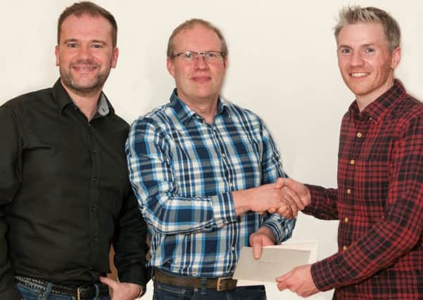 Kilbride Cyclists Chairman, Stephen Dunn (left), and Committee Member, Richard McGeagh (right), making a presentation on behalf of the members to outgoing Club Secretary David Hoy. The Kilbride Club has just celebrated its tenth anniversary and David was not only a founding member, but has also been Secretary since the Clubs formation, and has played a key role in helping the Club raise over Â£40,000 for charity.