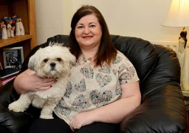 Shauna McCausland who has used the Home Treatment Crisis Response Service with her dog Ozzy.