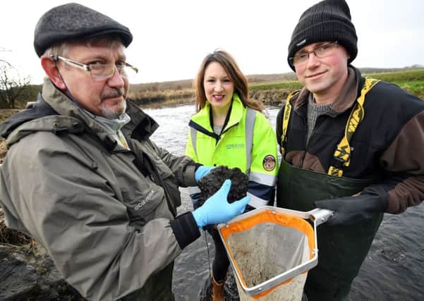 Pictured surveying the species levels at the new river bed site are Trevor Ogborn and Gary Houston of the Lagan River Trust, with Geri Wright from Phoenix Natural Gas.