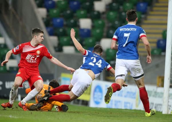 Josh Carson finds the net with an injury-time equaliser for Linfield but the 1-1 draw against bottom-placed Portadown proved a setback to the hosts' title ambitions. Pic by PressEye Ltd.