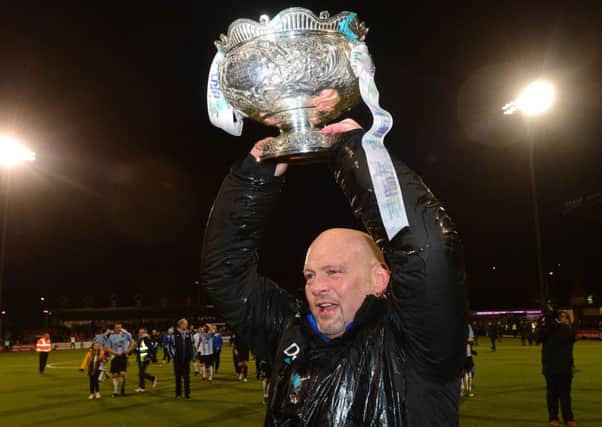 David Jeffrey holds aloft the League Cup following success for Ballymena United over Carrick Rangers. Pic by Pacemaker Ltd.