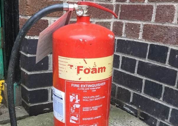 The fire extinguisher which was thrown at the pensioner's property.