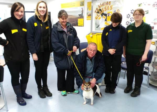 Rusty with Dogs Trust staff before leaving for his new forever home with his new owner (pictured centre).