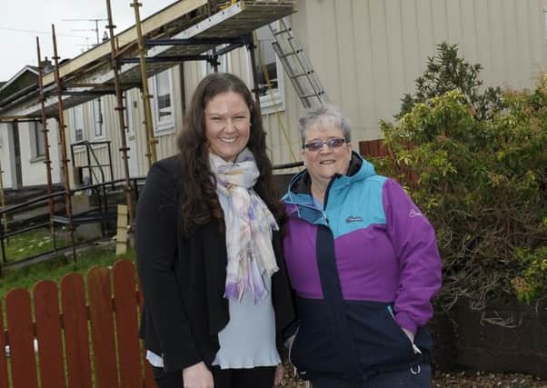 Huntly Bungalows resident Margaret Murray whose home is getting a new roof under the Housing Executives Thermal Comfort Scheme along with Assistant Housing Services Manager Patricia Beattie Â©Edward Byrne Photography INBL1708-215EB