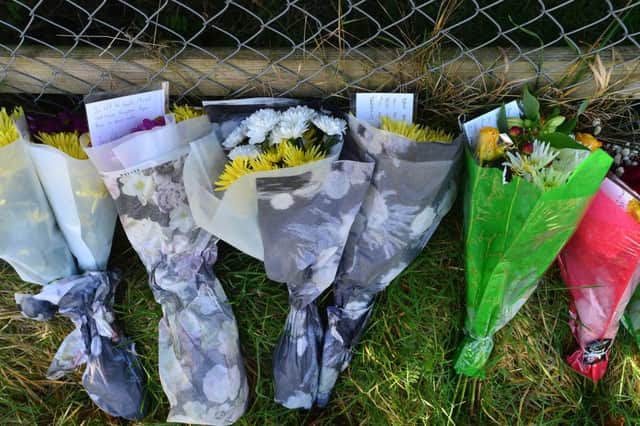 Floral tributes close to the scene of the Sprucefield scrambler crash. Picture by Arthur Allison, Pacemaker Press.