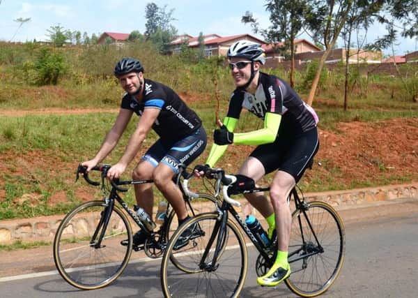 Cyclists Richard Henry and Patrick Chapman cycle across the land of a thousand hills.