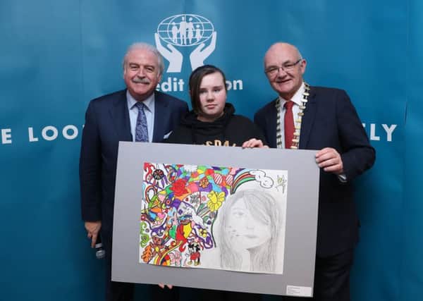 Shannon Ward winner in the 11-13 yrs special category  from Lurgan Credit Union,  with Marty Whelan and ILCU President Brian McCrory  in Croke Park. Pic by Maxwell Photgraphy.