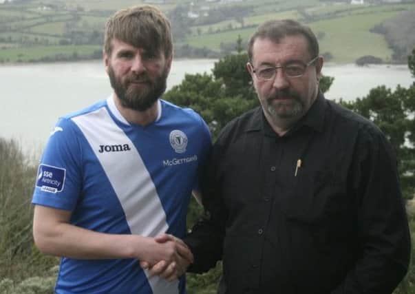 Paddy McCourt is welcomed to Finn Harps by secretary John Campbell.