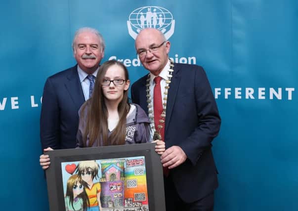 Ellen Mooney winner in the 14-17 yrs special category  from Portadown Credit Union,Armagh with Marty Whelan and ILCU President Brian McCrory  in Croke Park. Pic by Maxwell Photography