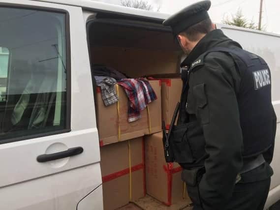 Police stop a van selling goods in Coalisland