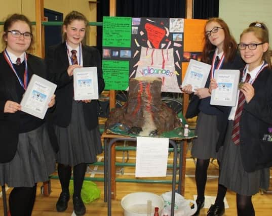 The winning team with their project on Volcanoes.