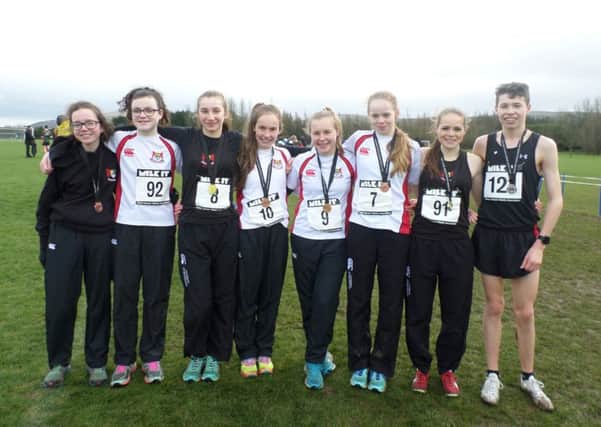 Banbridge Academy's eight cross-country athletes who qualified for the Irish Championships. L-R: Lucy Bradshaw, Nadia Radcliffe, Ruby McNiff, Julia Knox, Kathryn McGrath, Bethany Nixon, Rebekah Nixon and Patrick McNiff.