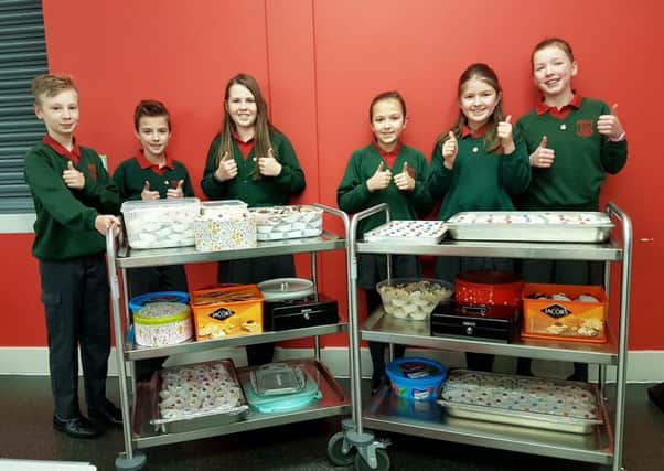 Pupils of Dromore Central PS with treats at the ready for their Valentine bun sale
