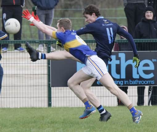 St. Ciaran's Cormac Donelly shots for goal under pressure from St Louis' Tiarnan Quigg during Saturday's MacLarnon Cup semi-final.