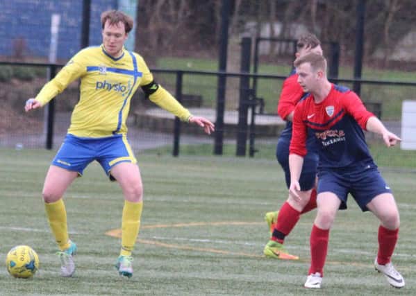 Roe Rovers midfielder Conor Mullan (left) sets up another attack against Caw, in their 3-1 win on Saturday.