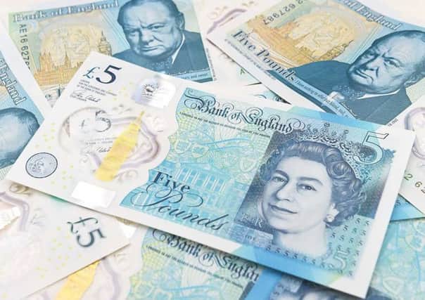 The new Bank of England Â£5 notes were introduced into circulation in September.